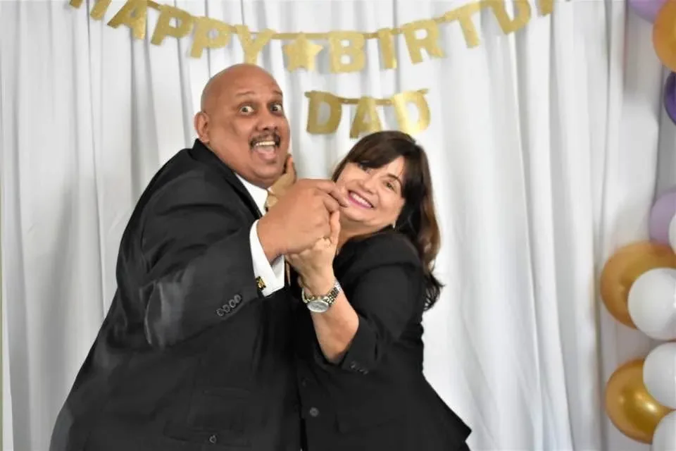 Luis and Mary Negron sharing a joyful moment